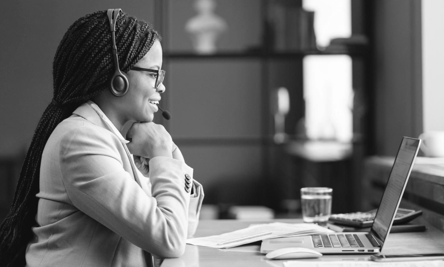Workshop participant working through a seasonal budget exercise at a desk